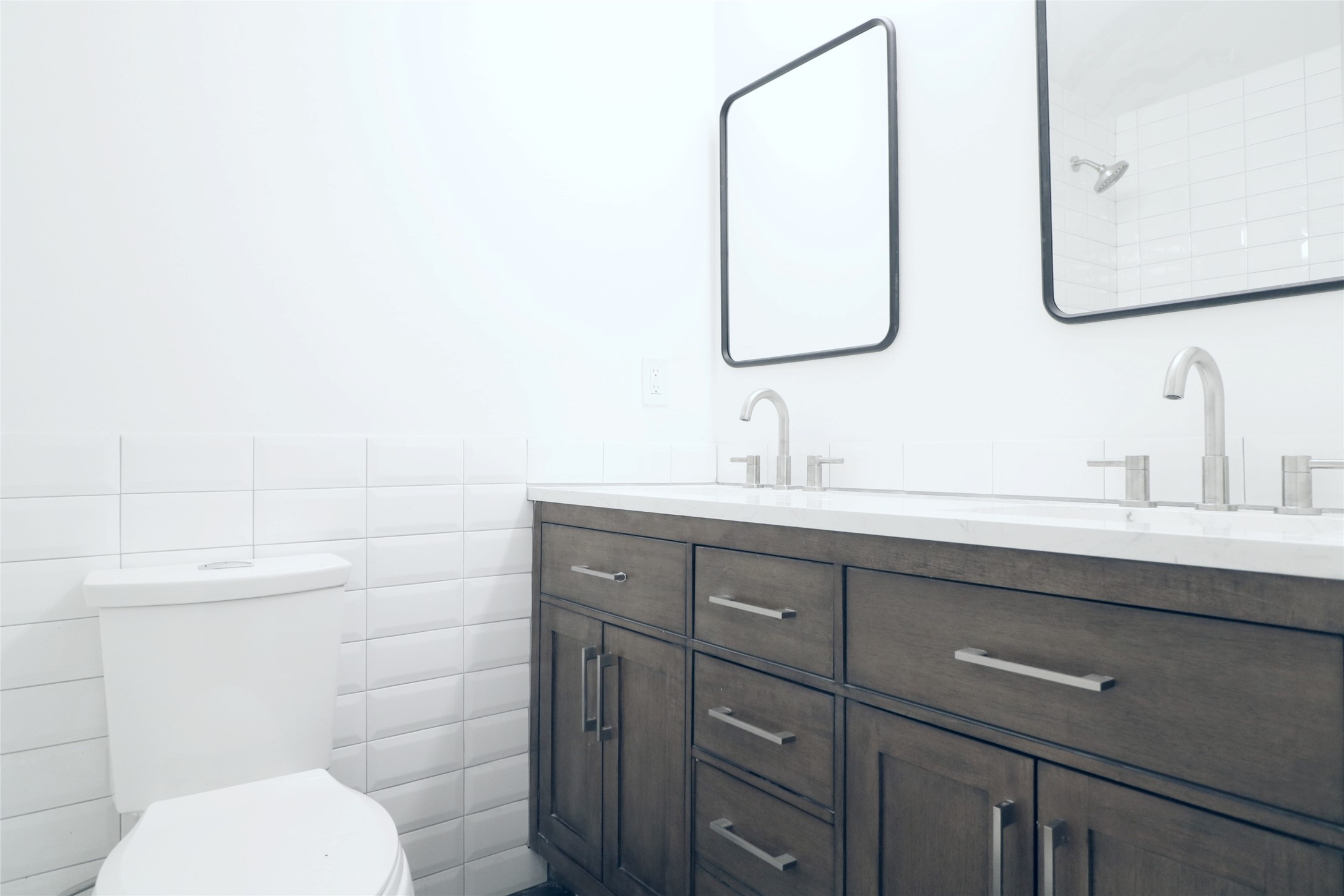 412 Pacific Street, Unit 9E Houston, TX 77006 - Photo 7 of 11 a bathroom with a toilet sink and mirror