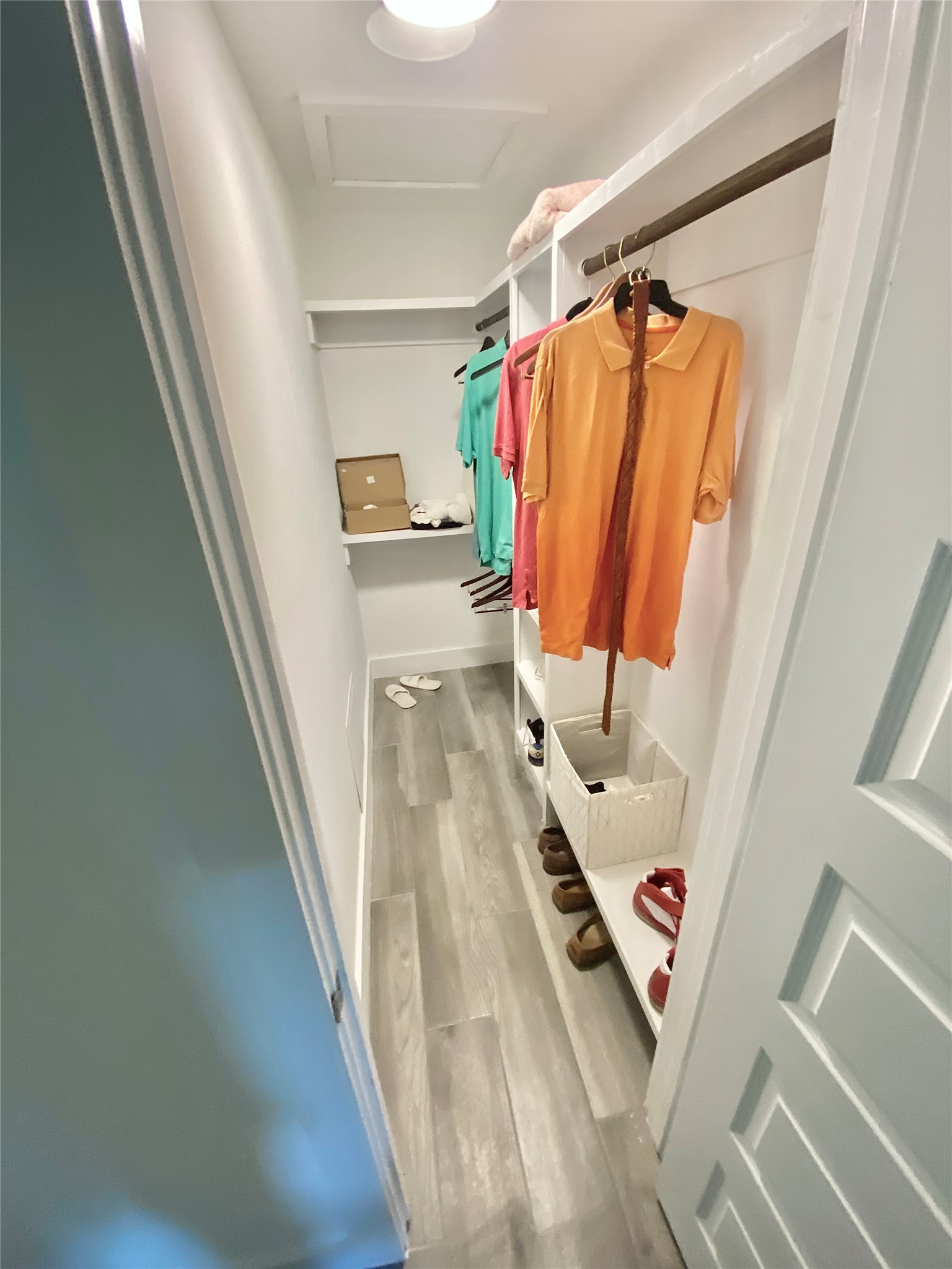 412 Pacific Street, Unit 9E Houston, TX 77006 - Photo 9 of 11 a view of walk in closet with clothes and shoes