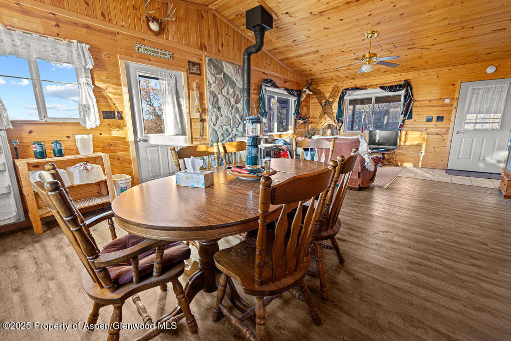 228 Eagle Loop Craig, CO 81625 - Photo 16 of 37 a dining room with furniture and wooden floor