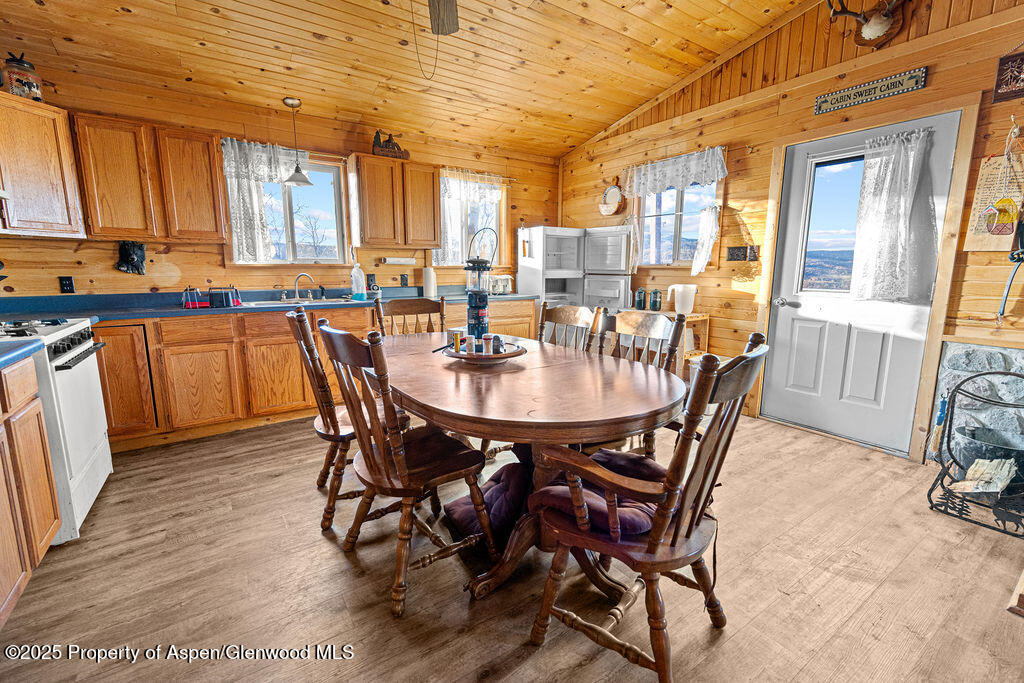 228 Eagle Loop Craig, CO 81625 - Photo 19 of 37 a view of a dining room with furniture and a window