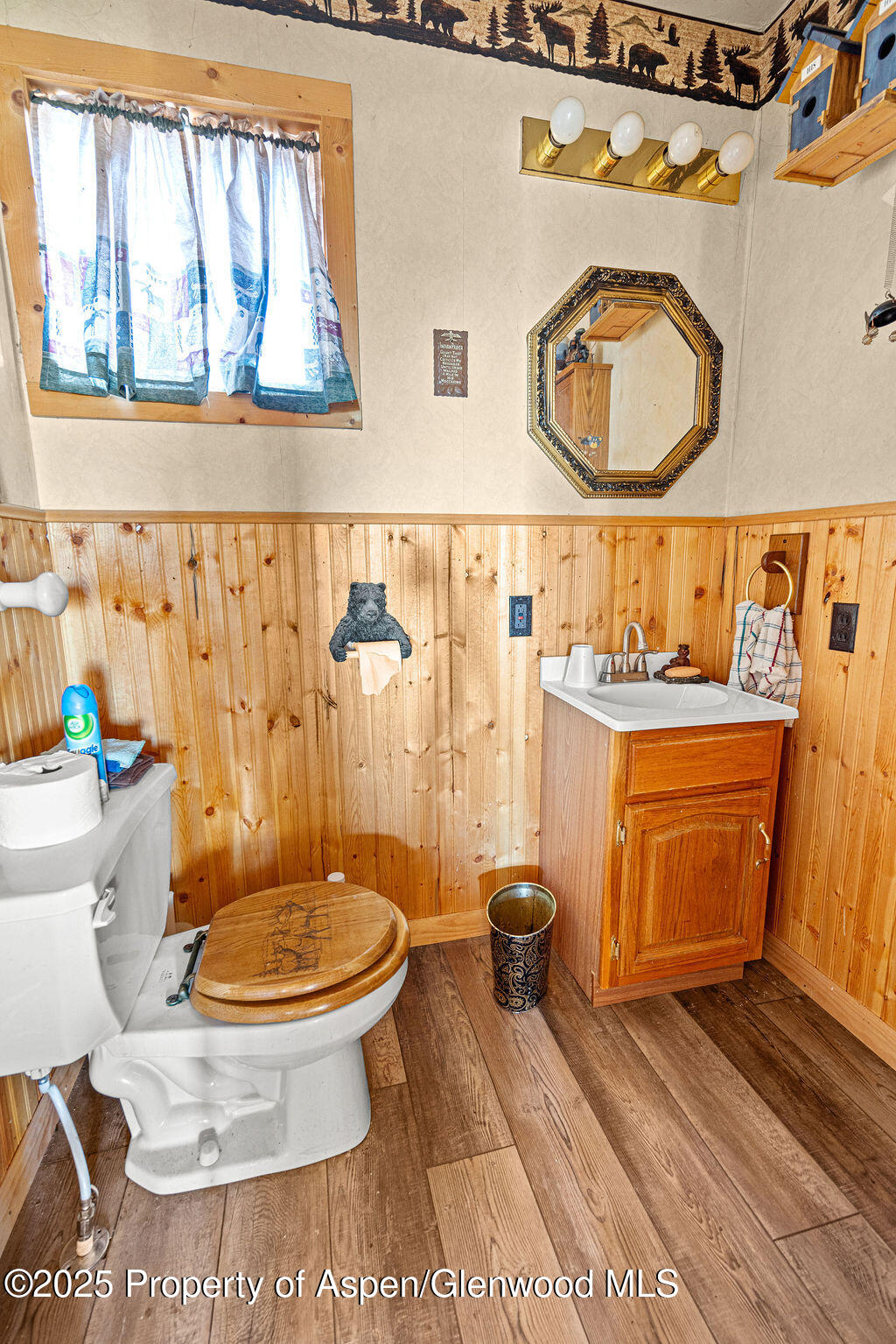 228 Eagle Loop Craig, CO 81625 - Photo 22 of 37 a bathroom with a toilet sink and mirror