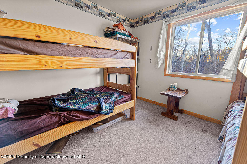 228 Eagle Loop Craig, CO 81625 - Photo 28 of 37 a bedroom with a bed and a window