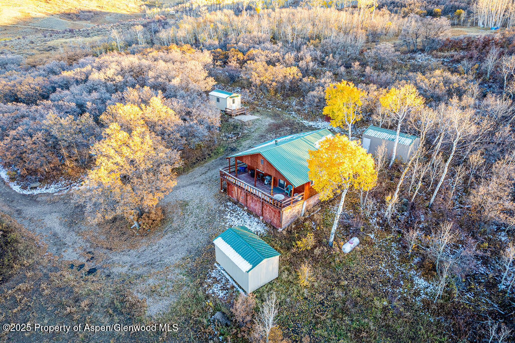228 Eagle Loop Craig, CO 81625 - Photo 5 of 37 an aerial view of a house with a yard and swimming pool