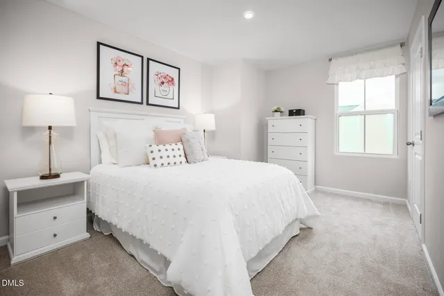 a bathroom with a sink toilet vanity and shower