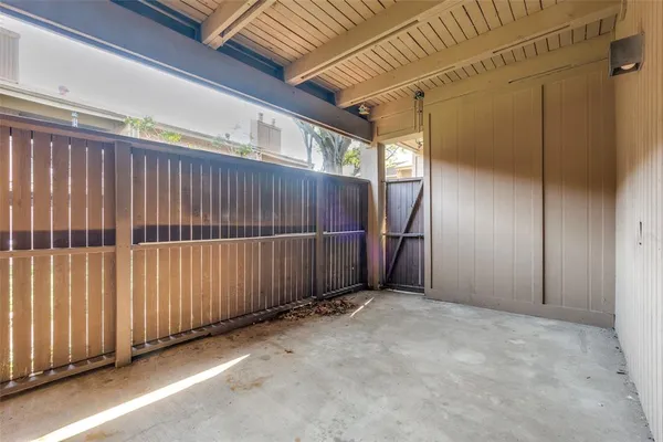 a view of an empty room with wooden walls