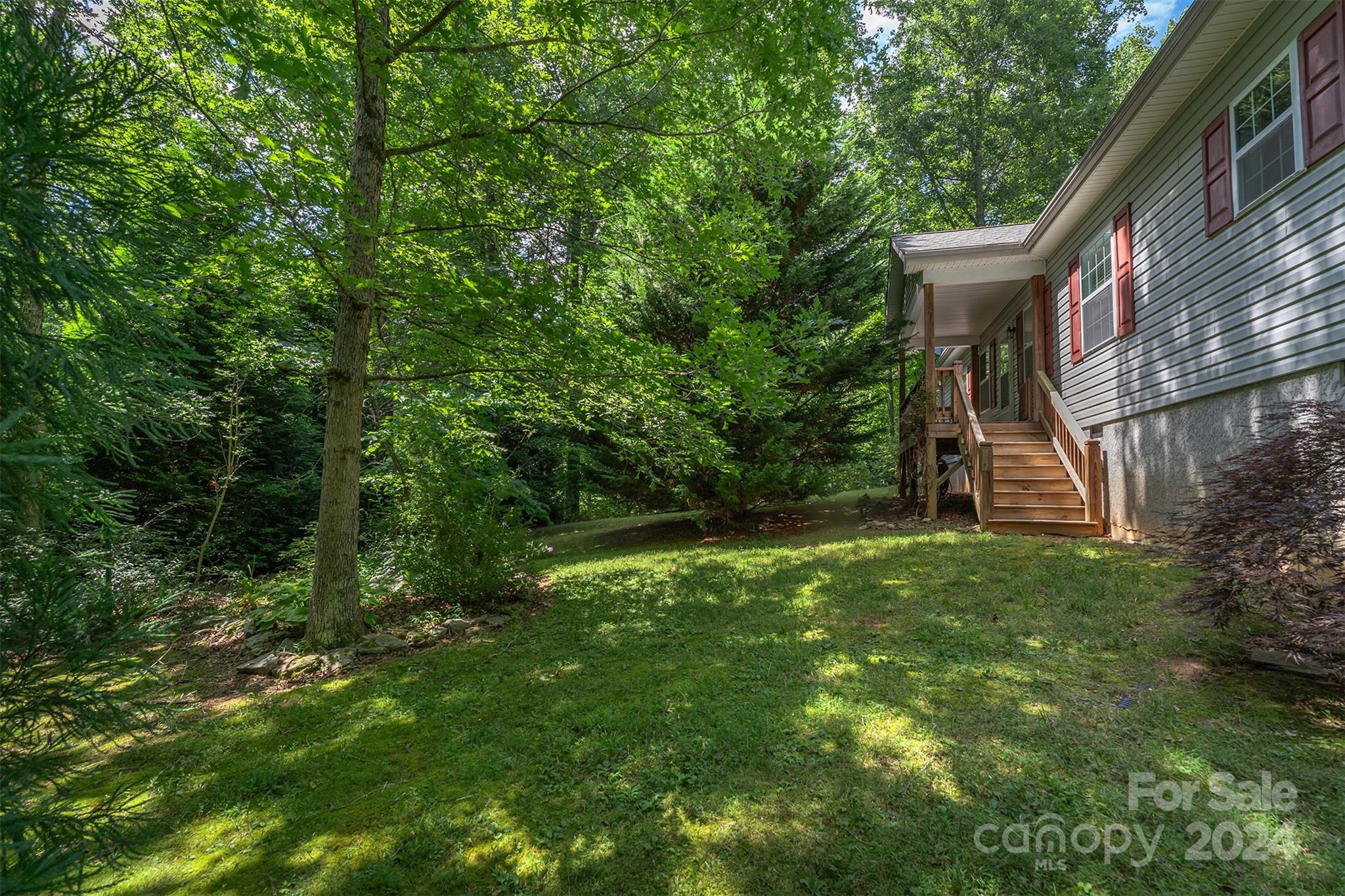 488 Anders Road Zirconia, NC 28790 - Photo 3 of 48 a view of a house with a yard