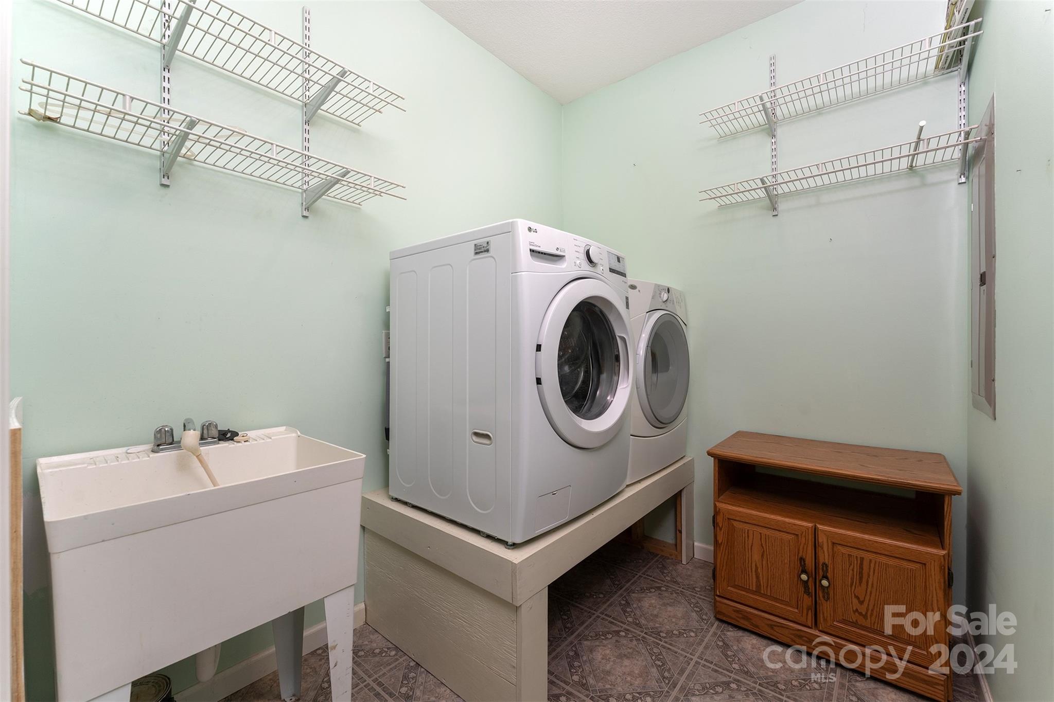 488 Anders Road Zirconia, NC 28790 - Photo 31 of 48 a utility room with dryer and washer