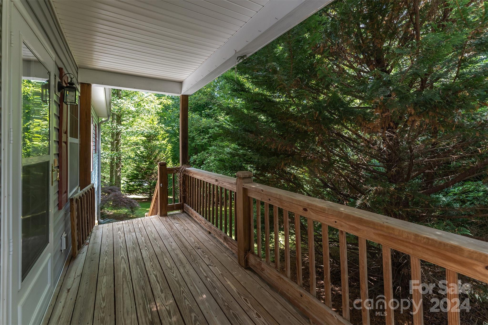488 Anders Road Zirconia, NC 28790 - Photo 4 of 48 a view of balcony with wooden floor and fence