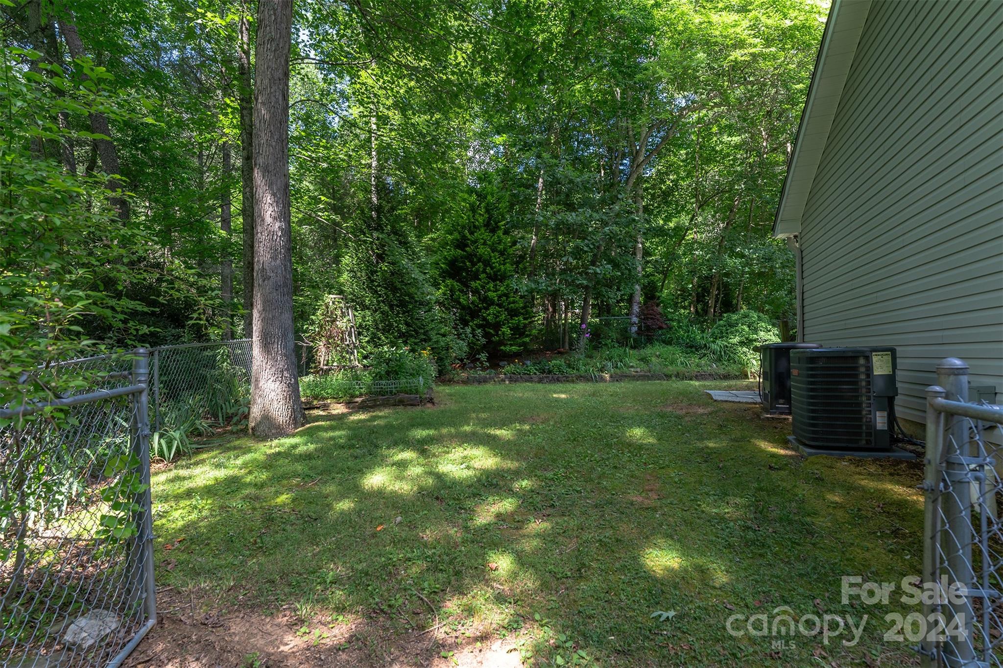 488 Anders Road Zirconia, NC 28790 - Photo 42 of 48 a backyard of a house with lots of green space
