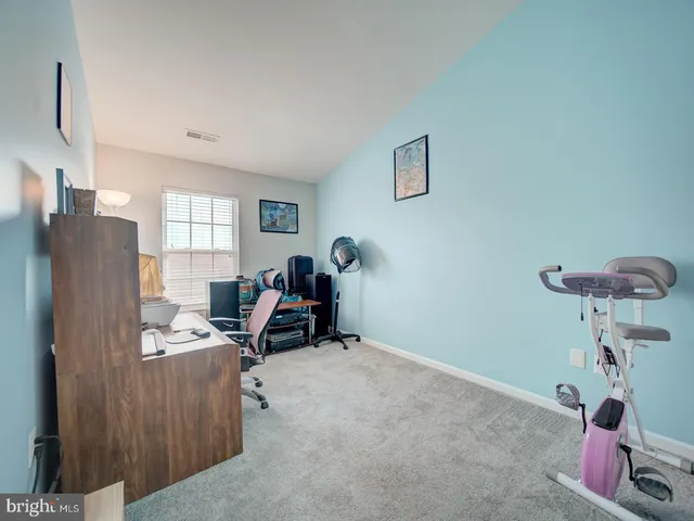 a view of a workspace with furniture