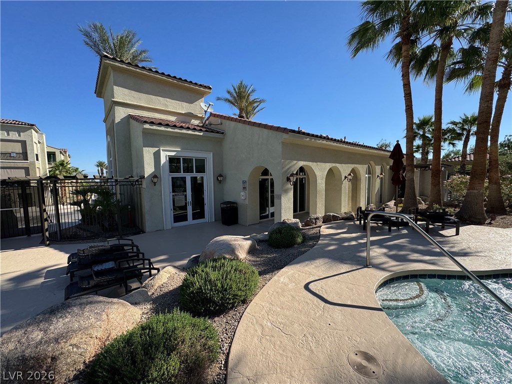 2555 Hampton Road, Unit 4205 Henderson, NV 89052 - Photo 50 of 52 This outdoor oasis offers a refreshing spa, manicured landscaping, and convenient amenities for relaxation.