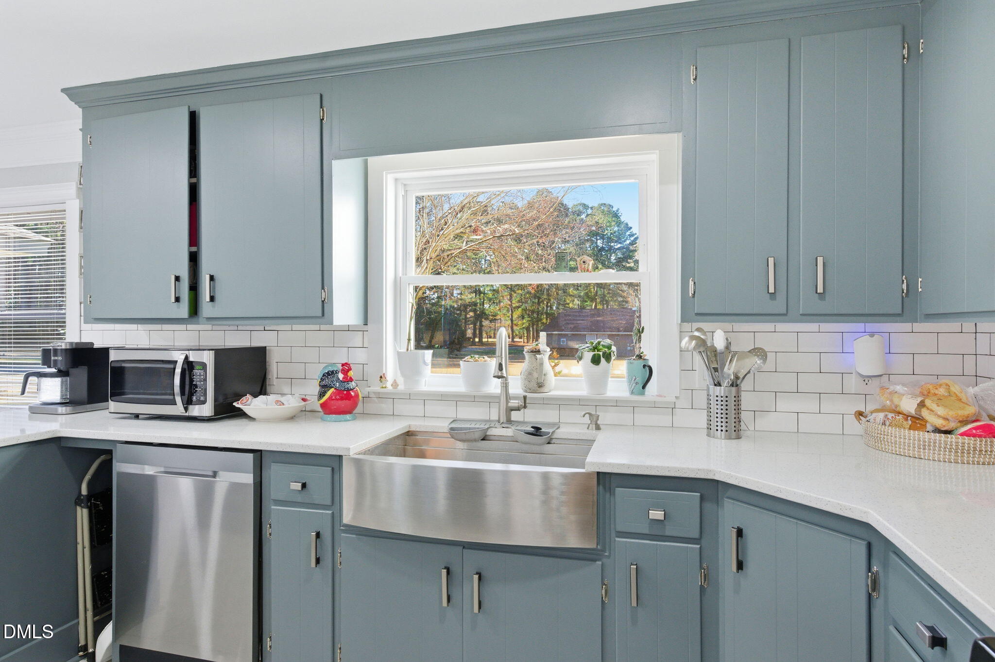 110 Circle Drive Spring Hope, NC 27882 - Photo 12 of 61 a kitchen with a sink cabinets and window