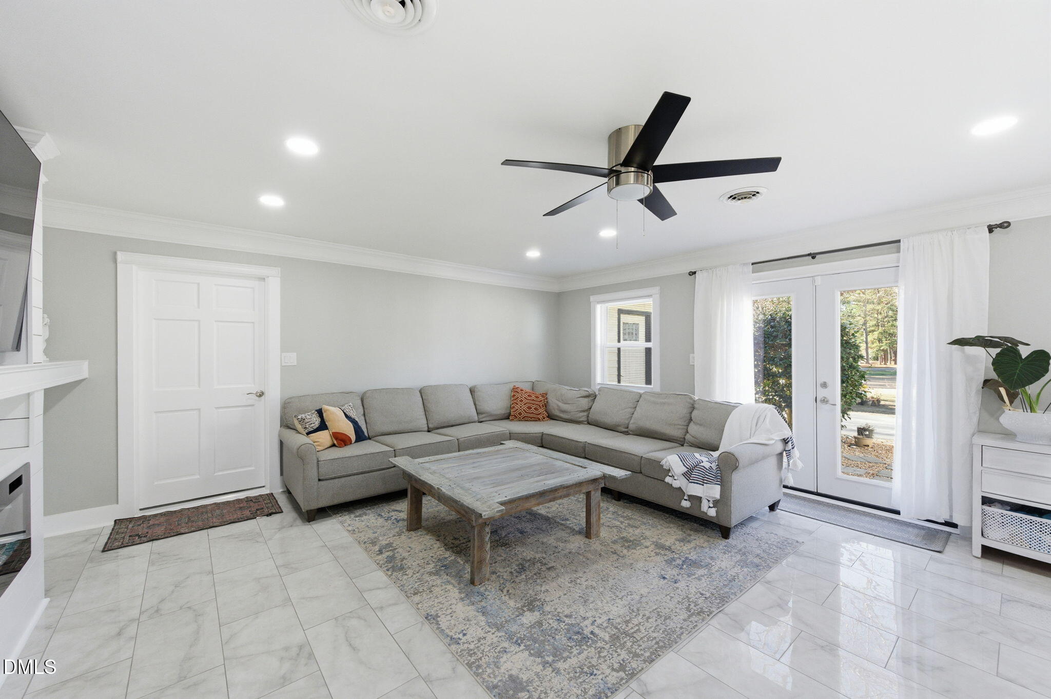 110 Circle Drive Spring Hope, NC 27882 - Photo 16 of 61 a living room with furniture and a ceiling fan