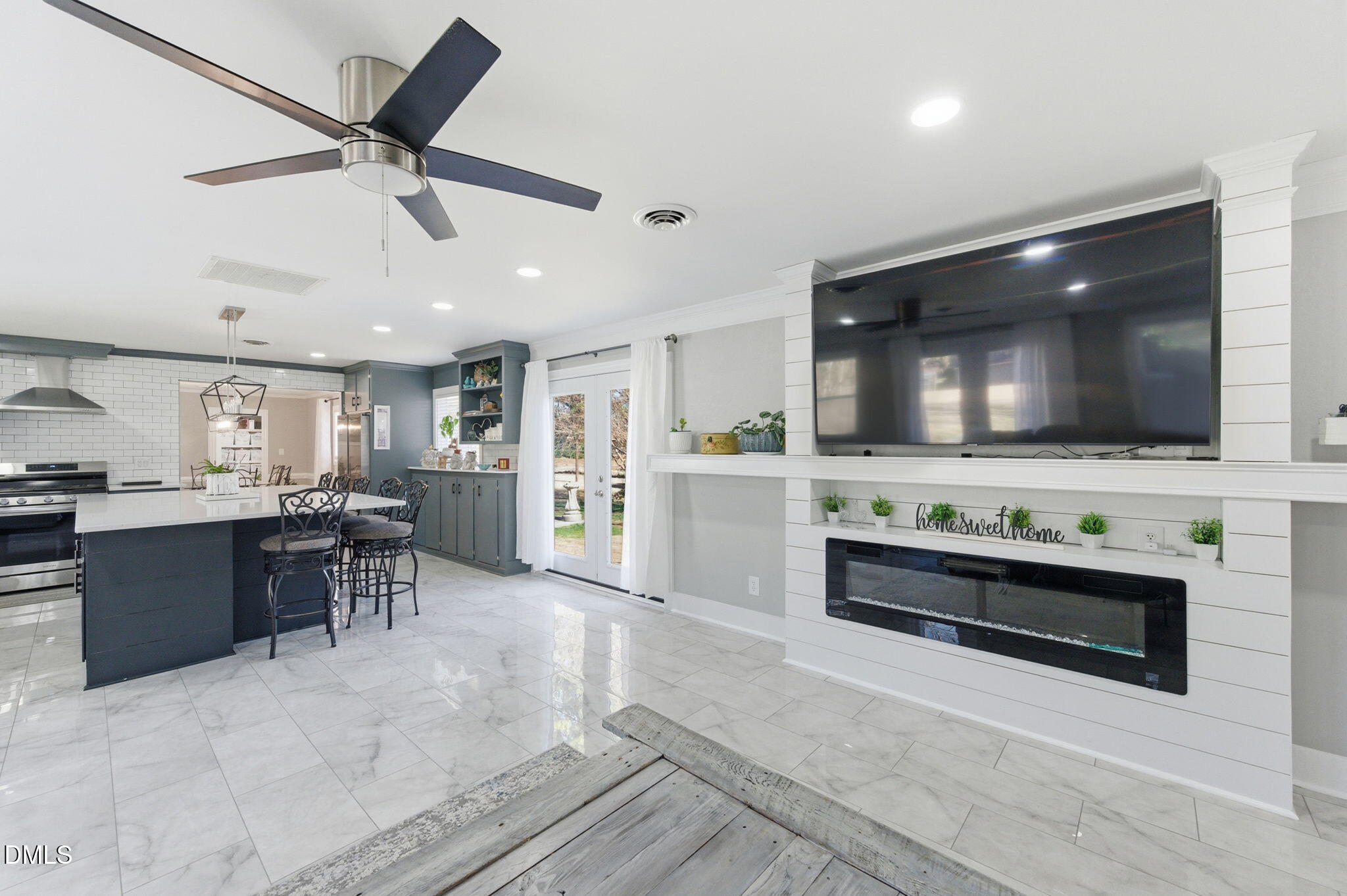 110 Circle Drive Spring Hope, NC 27882 - Photo 17 of 61 a living room with stainless steel appliances kitchen island furniture and flat screen tv