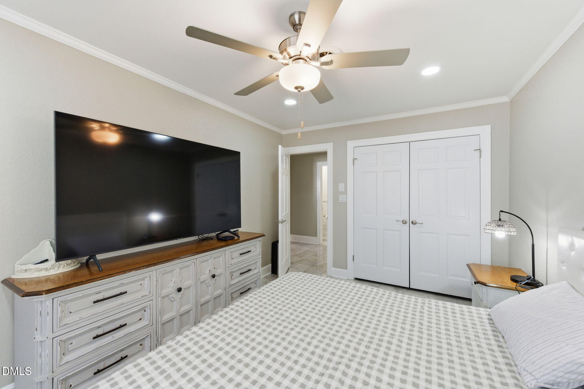 110 Circle Drive Spring Hope, NC 27882 - Photo 22 of 61 a bedroom with a bed and a flat screen tv