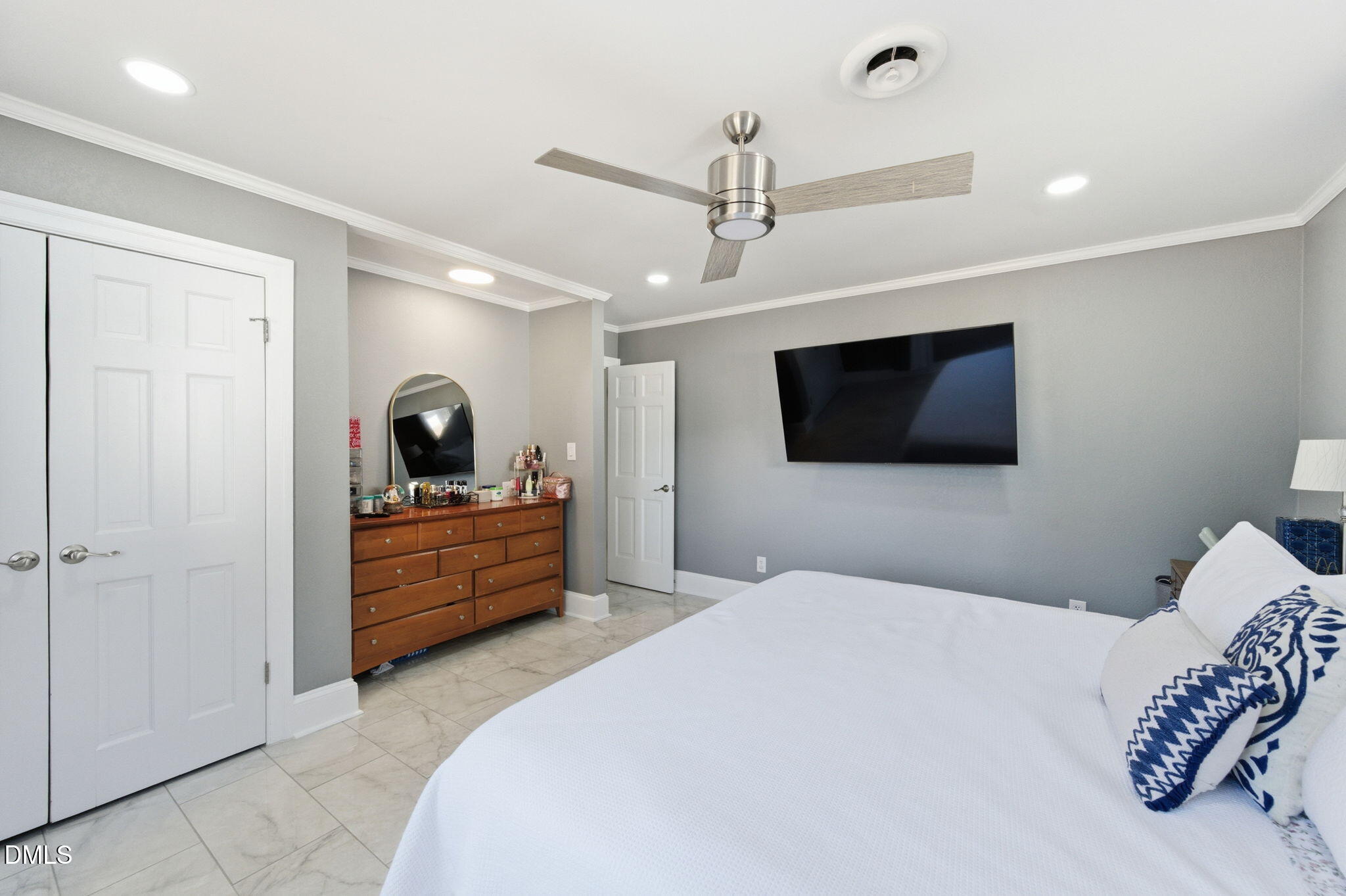 110 Circle Drive Spring Hope, NC 27882 - Photo 29 of 61 a large bedroom with a bed and a flat screen tv