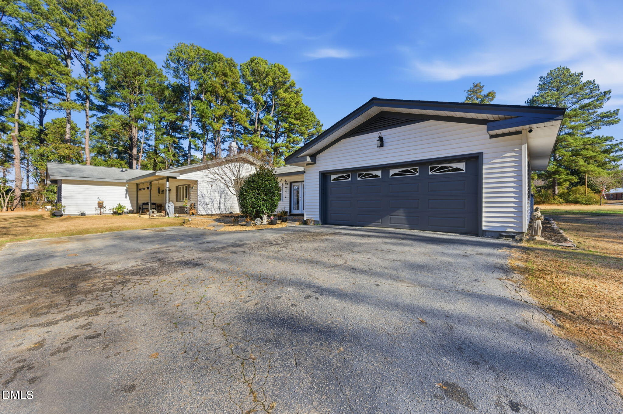 110 Circle Drive Spring Hope, NC 27882 - Photo 50 of 61 a front view of a house with a yard and garage