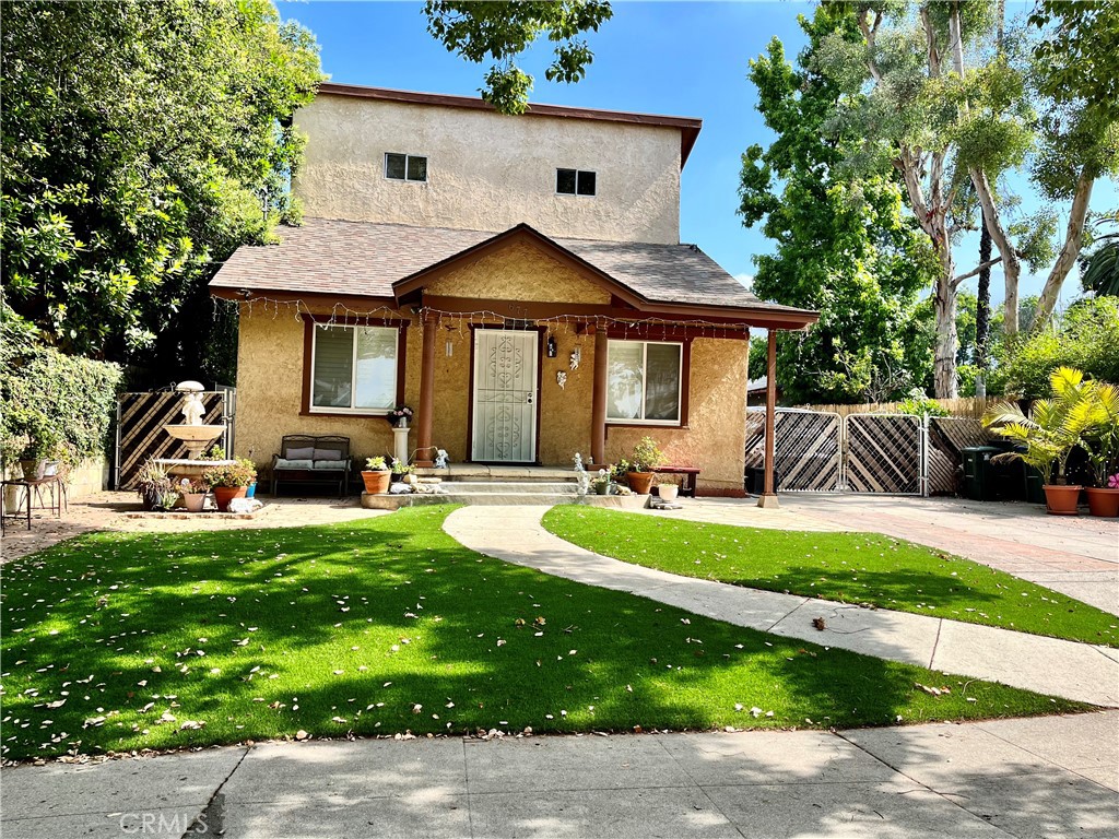 a front view of a house with a yard patio and fire pit