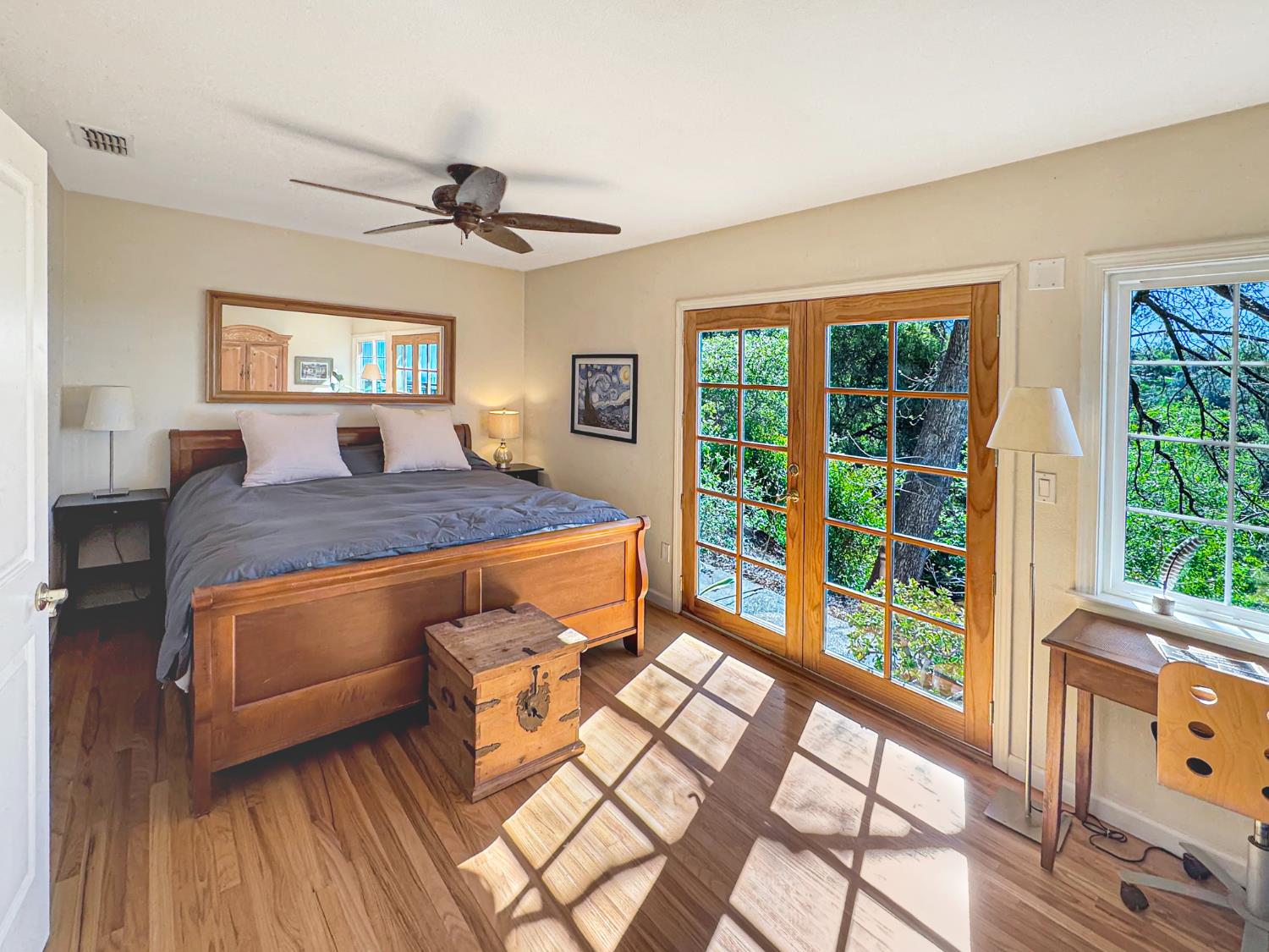 10100 Indian Hill Road Newcastle, CA 95658 - Photo 15 of 41 a bedroom with a bed and wooden floor