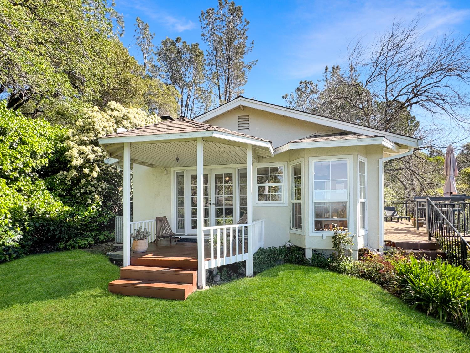 10100 Indian Hill Road Newcastle, CA 95658 - Photo 19 of 41 a view of a house with a yard and deck