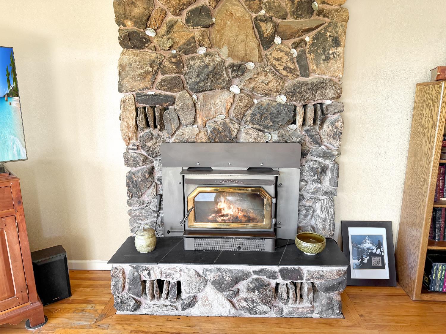 10100 Indian Hill Road Newcastle, CA 95658 - Photo 27 of 41 a living room with a couch and a fireplace