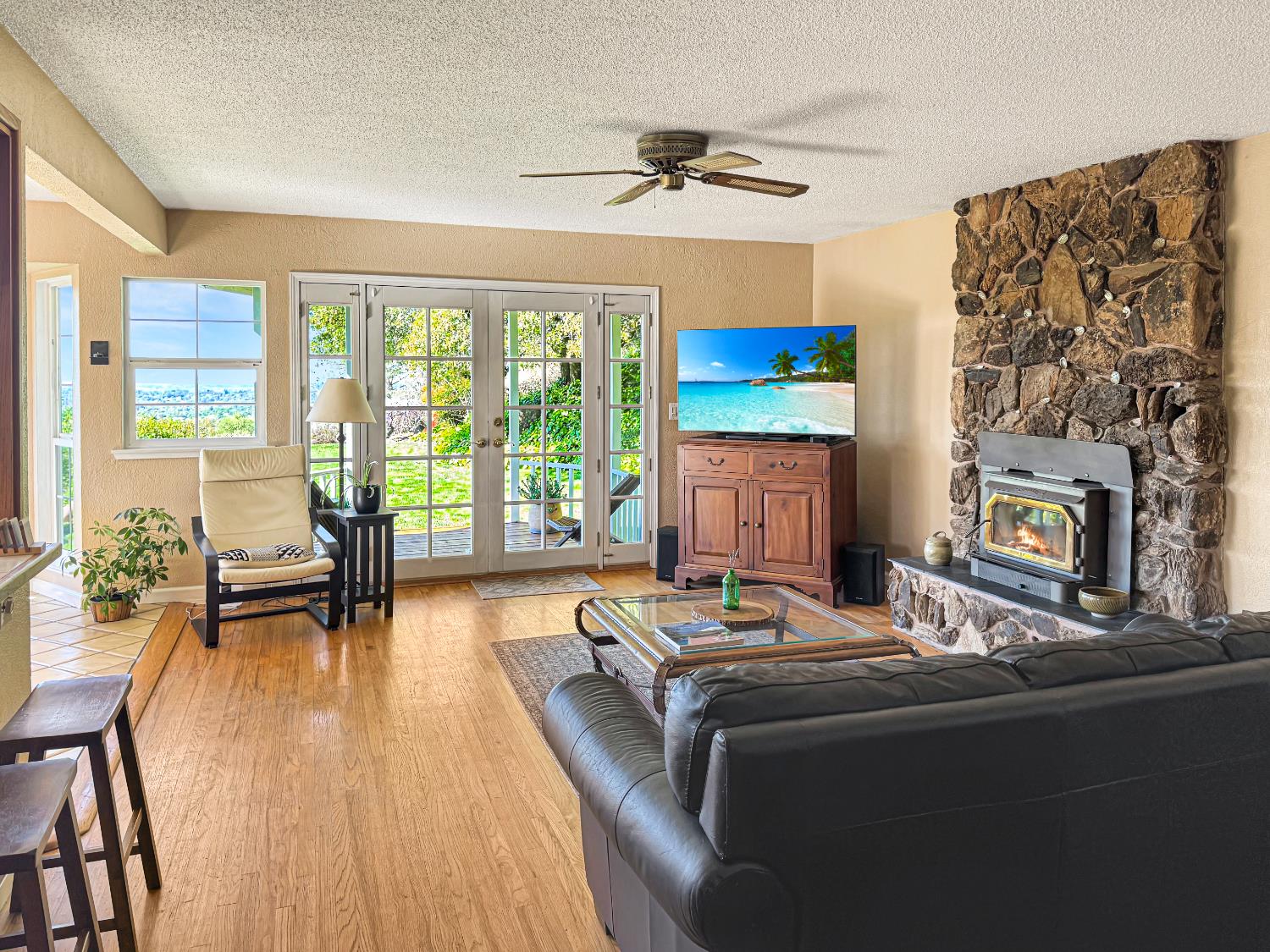 10100 Indian Hill Road Newcastle, CA 95658 - Photo 6 of 41 a living room with fireplace furniture and a flat screen tv
