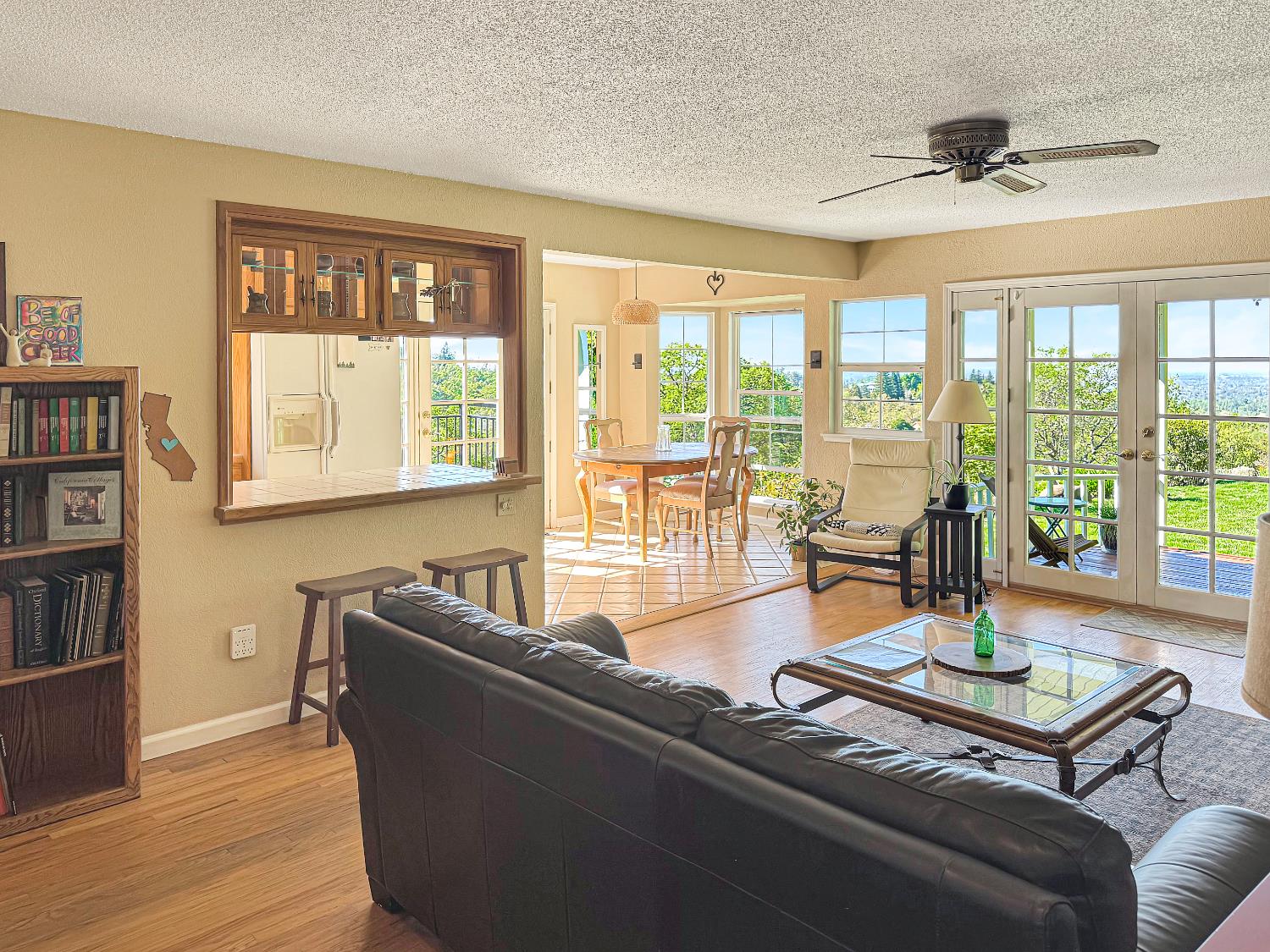10100 Indian Hill Road Newcastle, CA 95658 - Photo 9 of 41 a living room with furniture and floor to ceiling windows