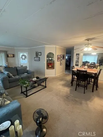 a kitchen with white cabinets and appliances