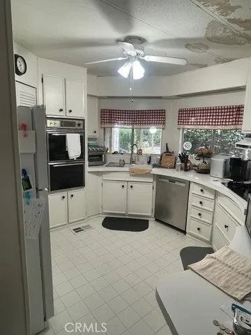 a bedroom with a bed dresser and a window