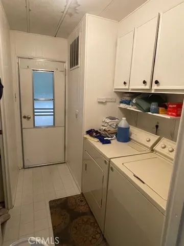 a bed room with a bed and a large window