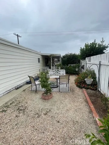 a view of a backyard with sitting area