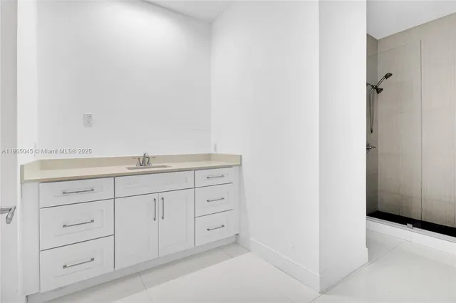a bathroom with a sink and vanity