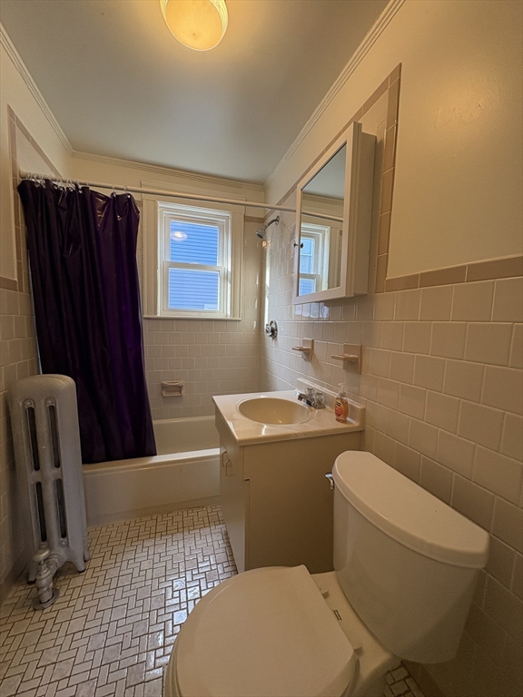 155-157 Hillside Street, Unit 1 Boston, MA 02120 - Photo 12 of 18 a bathroom with a toilet a sink and mirror