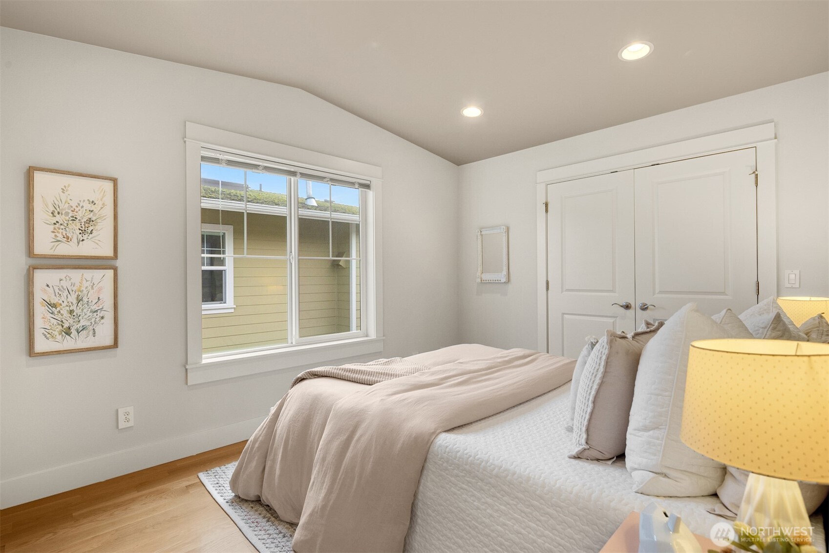 1500 South 5th Place Renton, WA 98057 - Photo 19 of 40 a bedroom with a bed and wooden floor