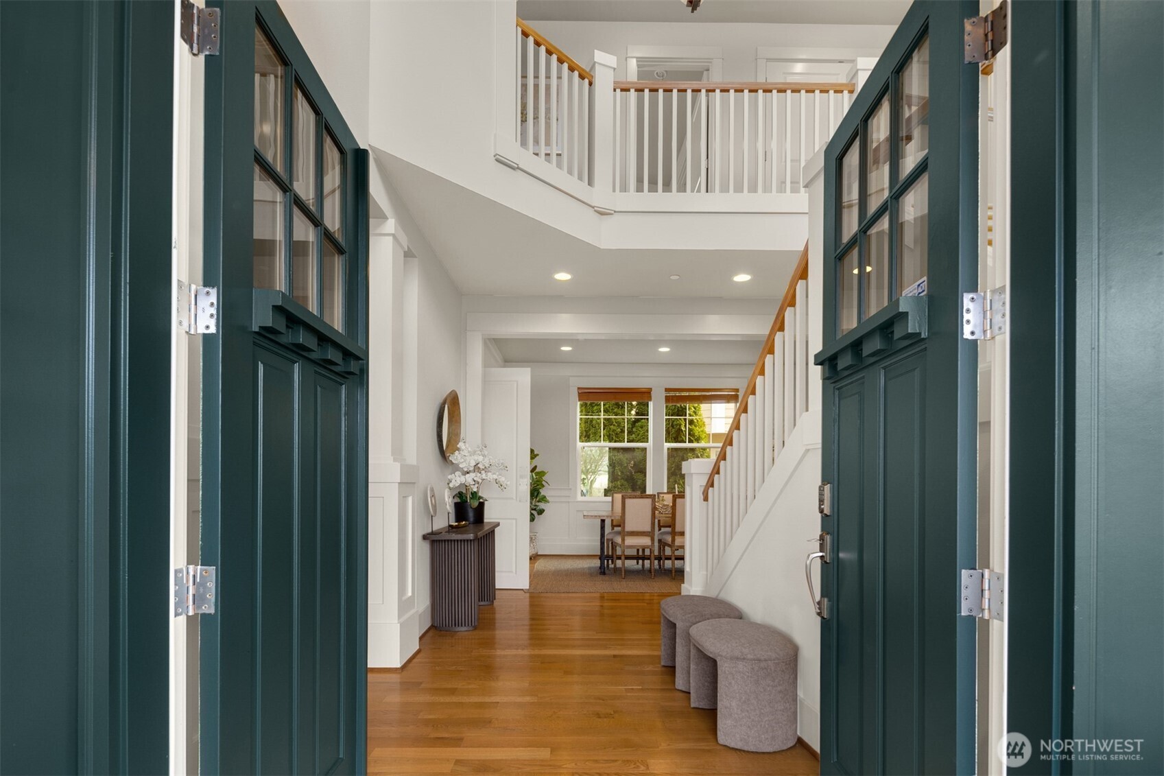 1500 South 5th Place Renton, WA 98057 - Photo 2 of 40 a view of an entryway with wooden floor and a livingroom view