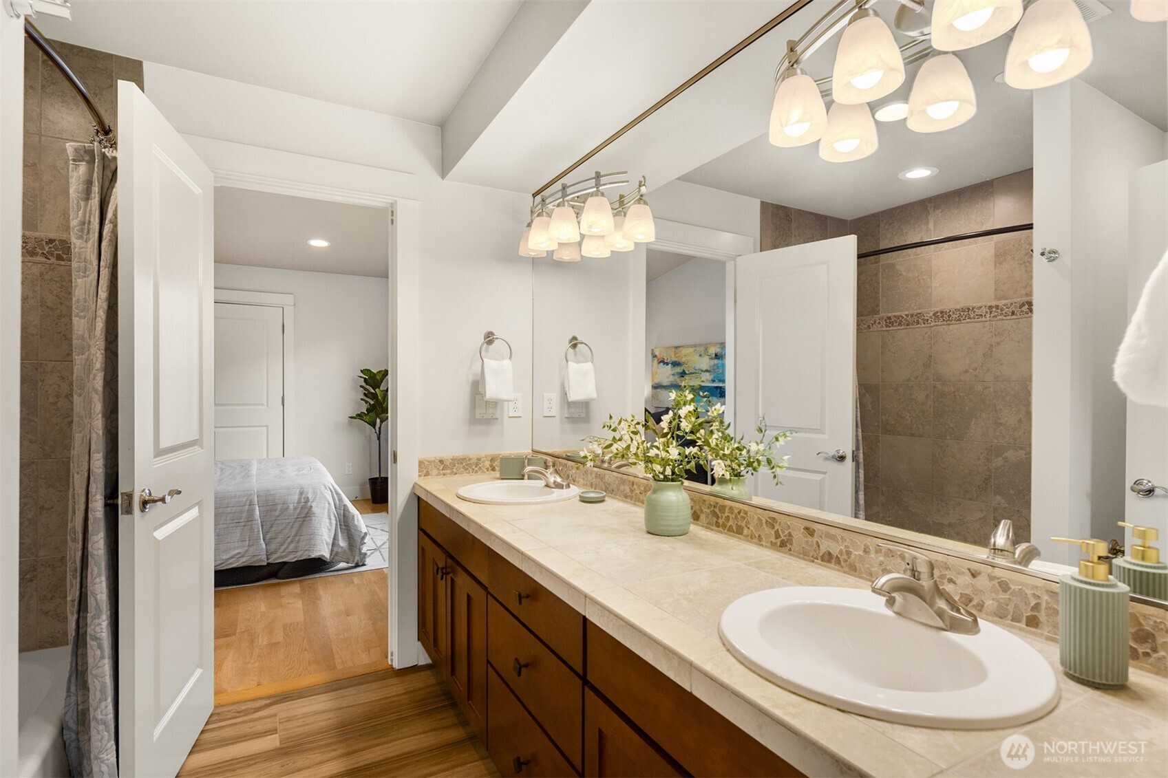 1500 South 5th Place Renton, WA 98057 - Photo 21 of 40 a en suite bathroom with a double vanity sink and a mirror