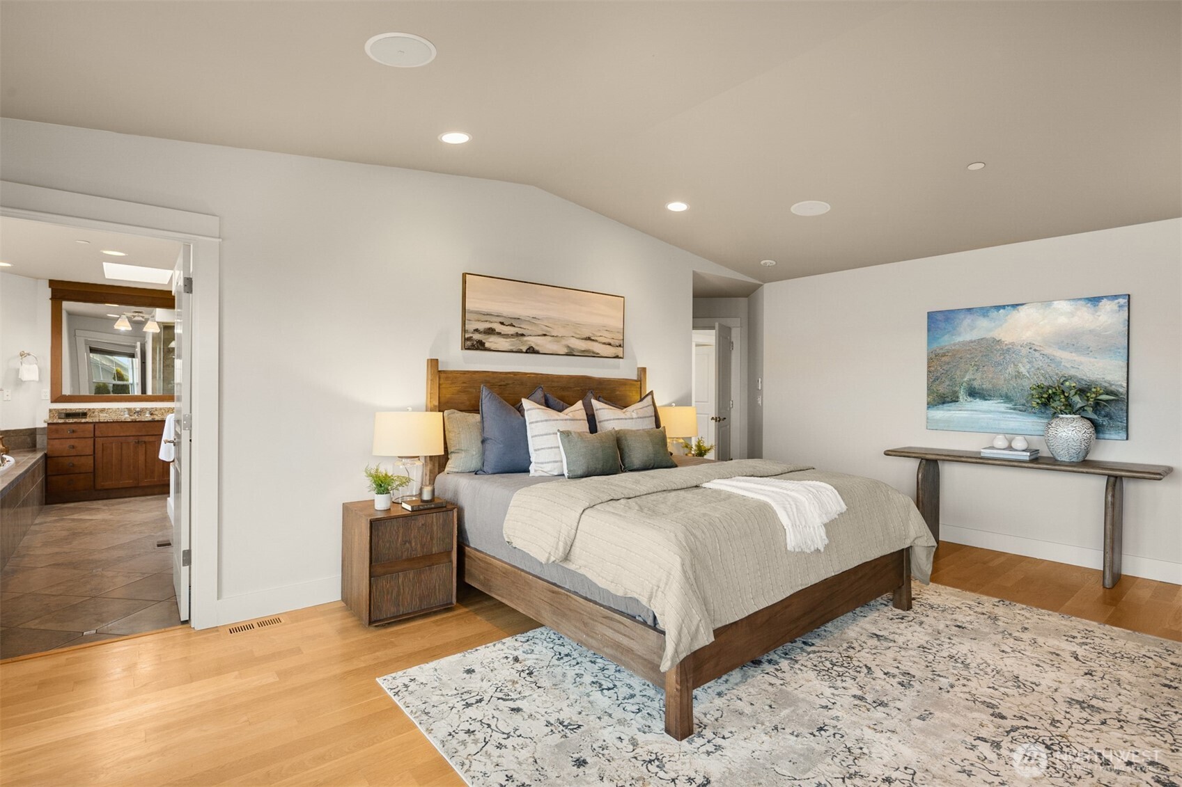 1500 South 5th Place Renton, WA 98057 - Photo 30 of 40 a bedroom with a large bed and a chandelier