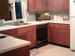 95 Goose Point Road Centerville, MA 02601 - Photo 3 of 9 a kitchen with stainless steel appliances a stove a sink and a microwave