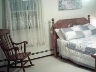 95 Goose Point Road Centerville, MA 02601 - Photo 7 of 9 a bedroom with a bed and a table