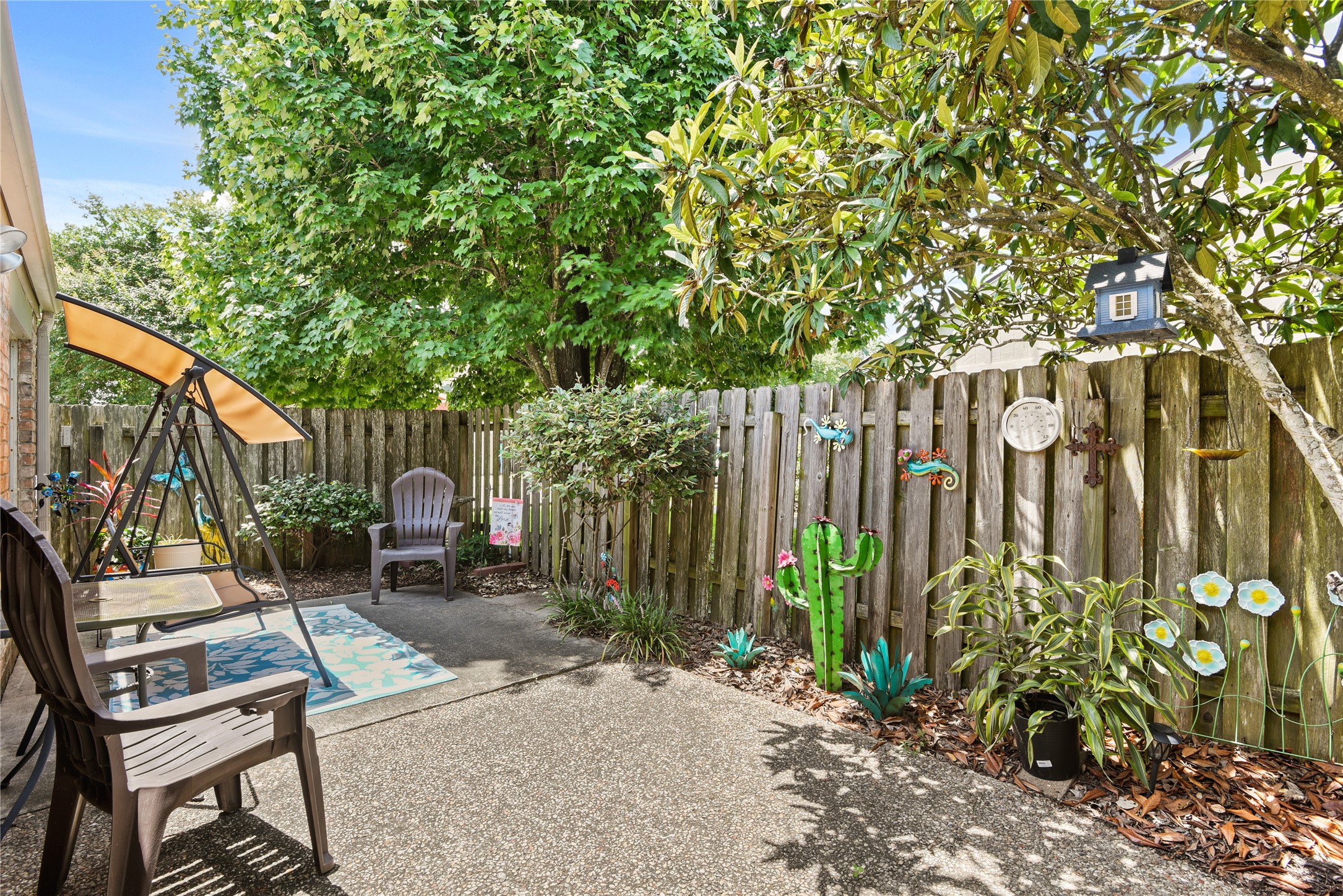 546 Georgetown Street, Unit 4 Beaumont, TX 77707 - Photo 5 of 14 a view of a chairs in a backyard