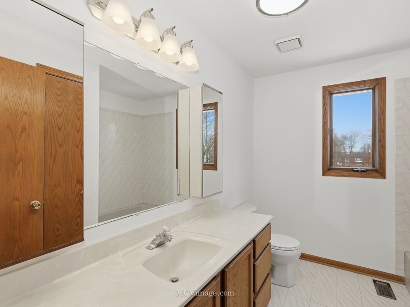 729 Eighth Avenue Addison, IL 60101 - Photo 14 of 21 a bathroom with a sink vanity granite and toilet
