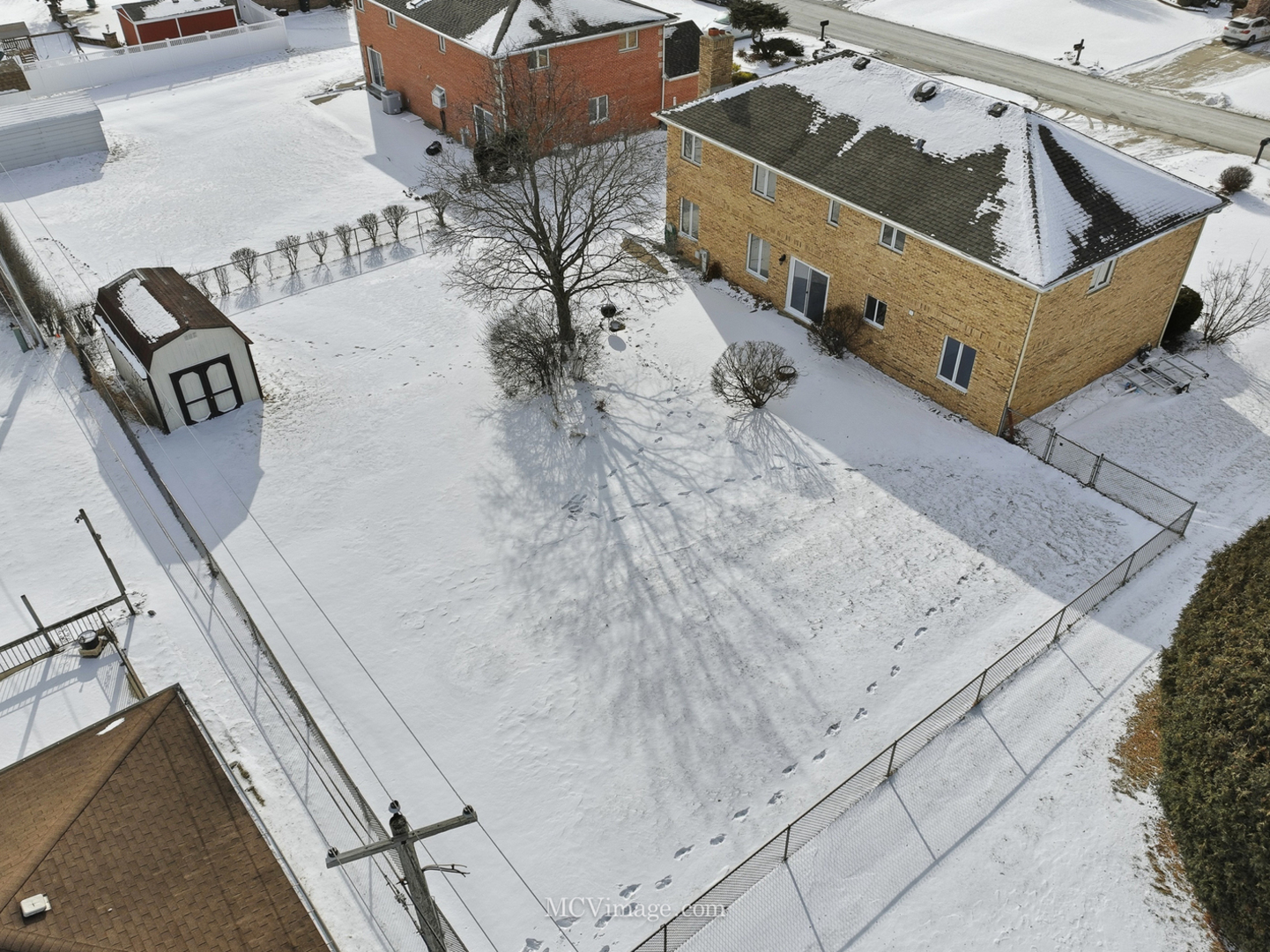 729 Eighth Avenue Addison, IL 60101 - Photo 18 of 21 a view of a terrace with wooden fence