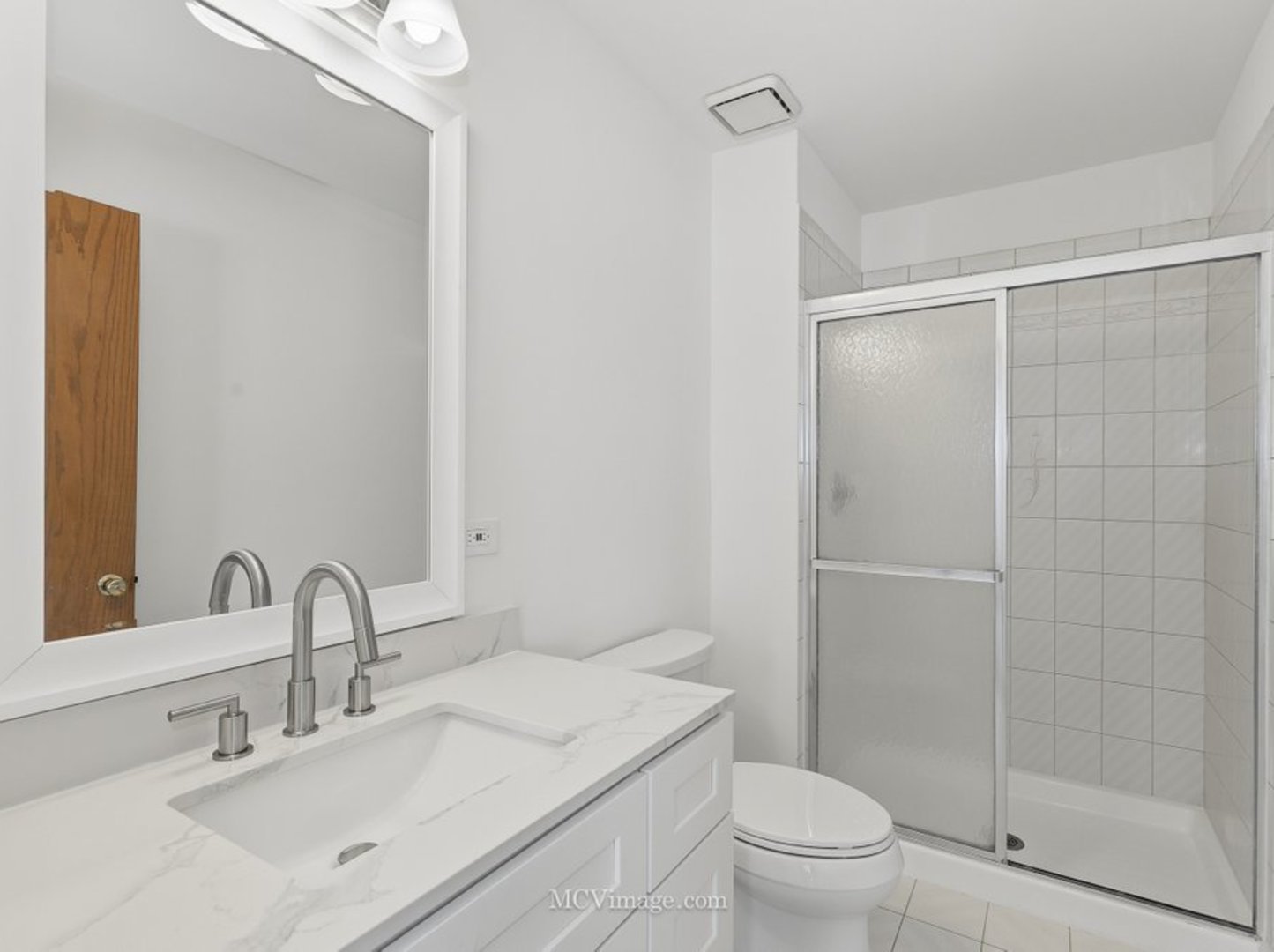 729 Eighth Avenue Addison, IL 60101 - Photo 7 of 21 a bathroom with a sink toilet and shower