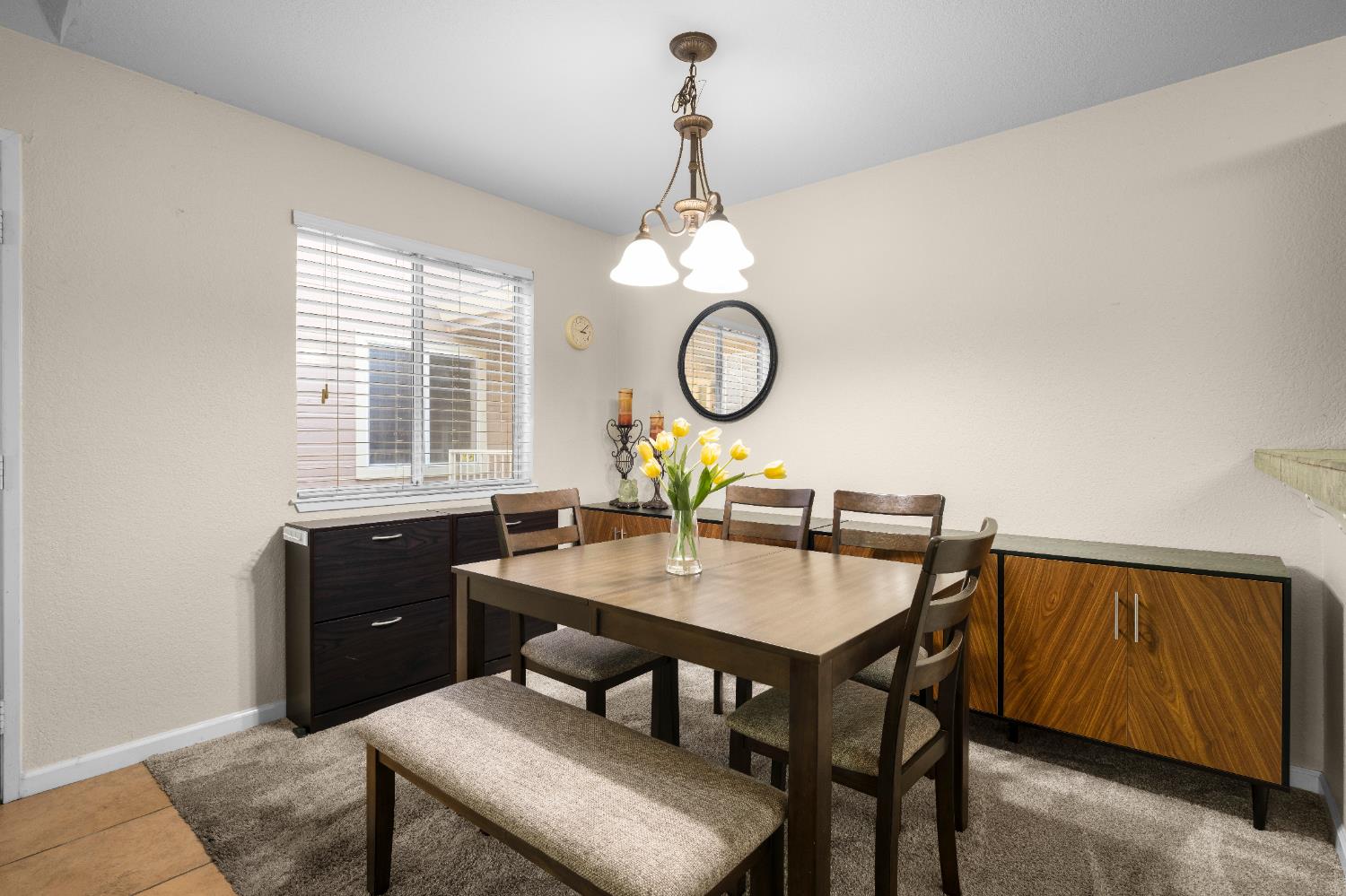11150 Trinity River Drive, Unit 42 Rancho Cordova, CA 95670 - Photo 12 of 32 a view of a dining room and a table and chairs