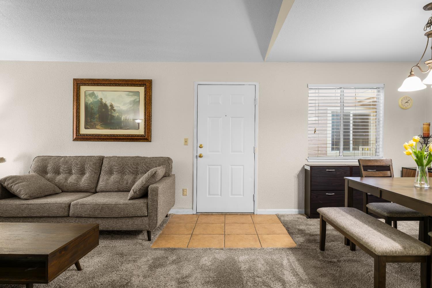 11150 Trinity River Drive, Unit 42 Rancho Cordova, CA 95670 - Photo 13 of 32 a living room with furniture and a window