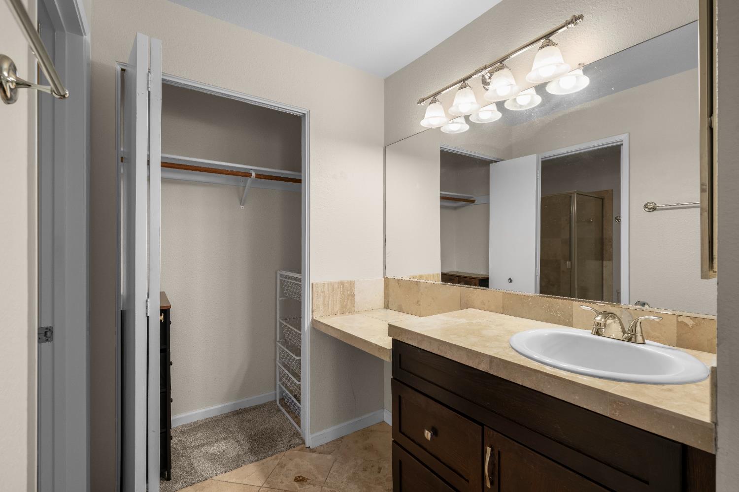 11150 Trinity River Drive, Unit 42 Rancho Cordova, CA 95670 - Photo 22 of 32 a bathroom with a sink double vanity and a mirror