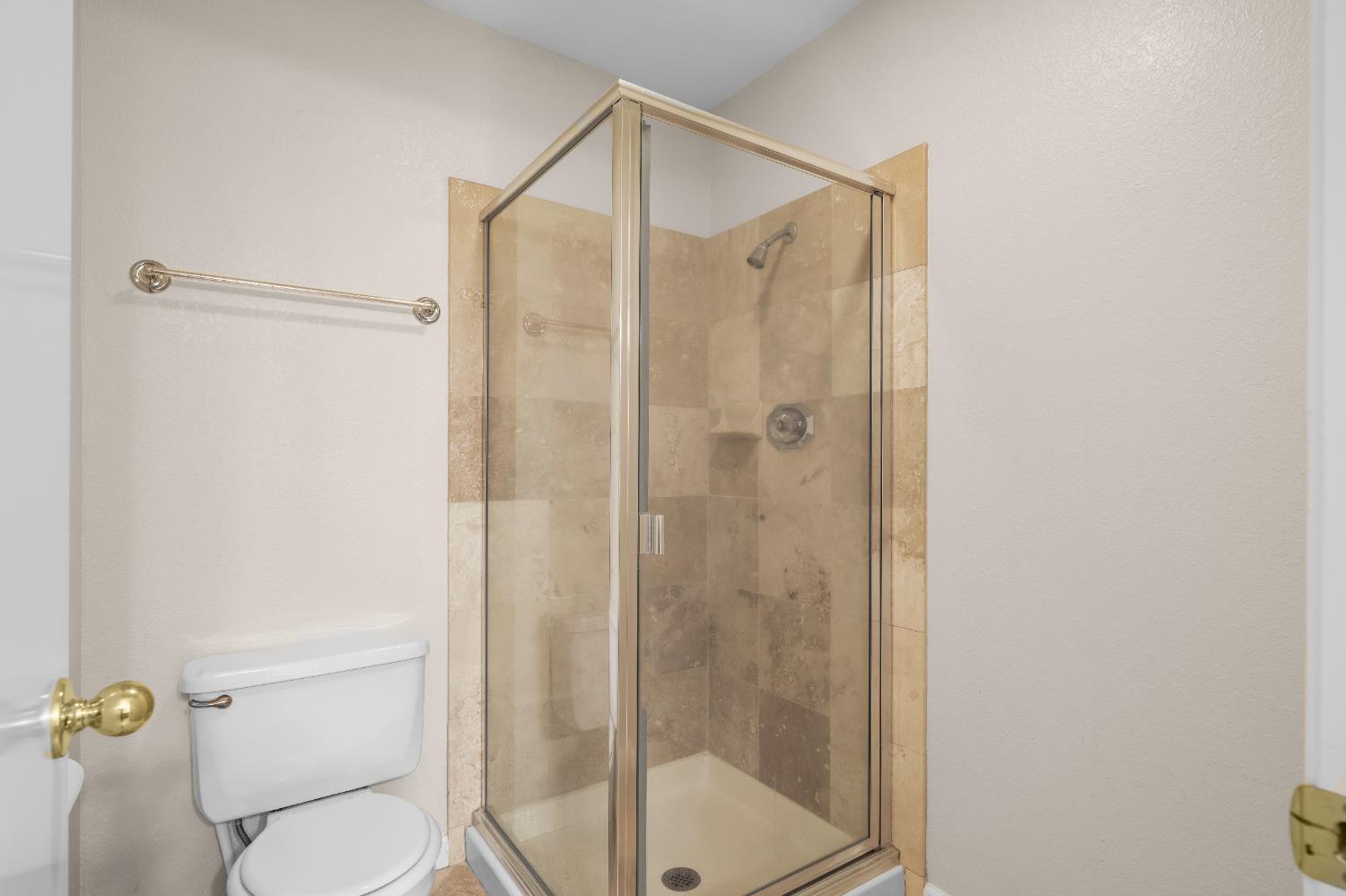 11150 Trinity River Drive, Unit 42 Rancho Cordova, CA 95670 - Photo 23 of 32 a bathroom that has a glass shower door