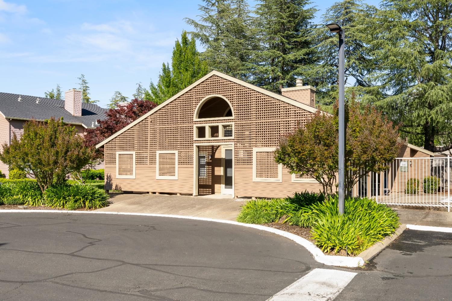 11150 Trinity River Drive, Unit 42 Rancho Cordova, CA 95670 - Photo 30 of 32 a front view of a house with a garden