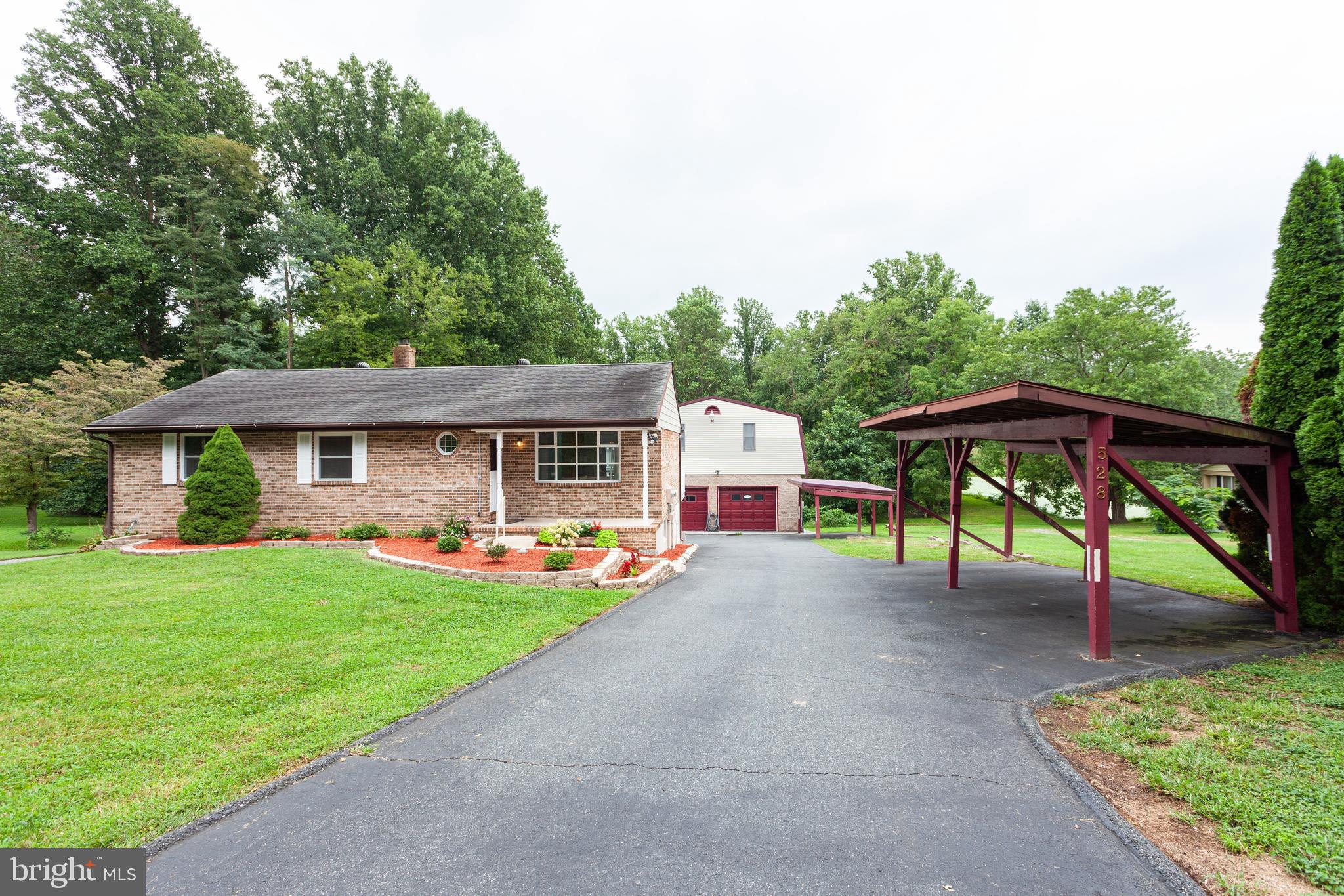 All brick rancher w/ detached garage and apartment