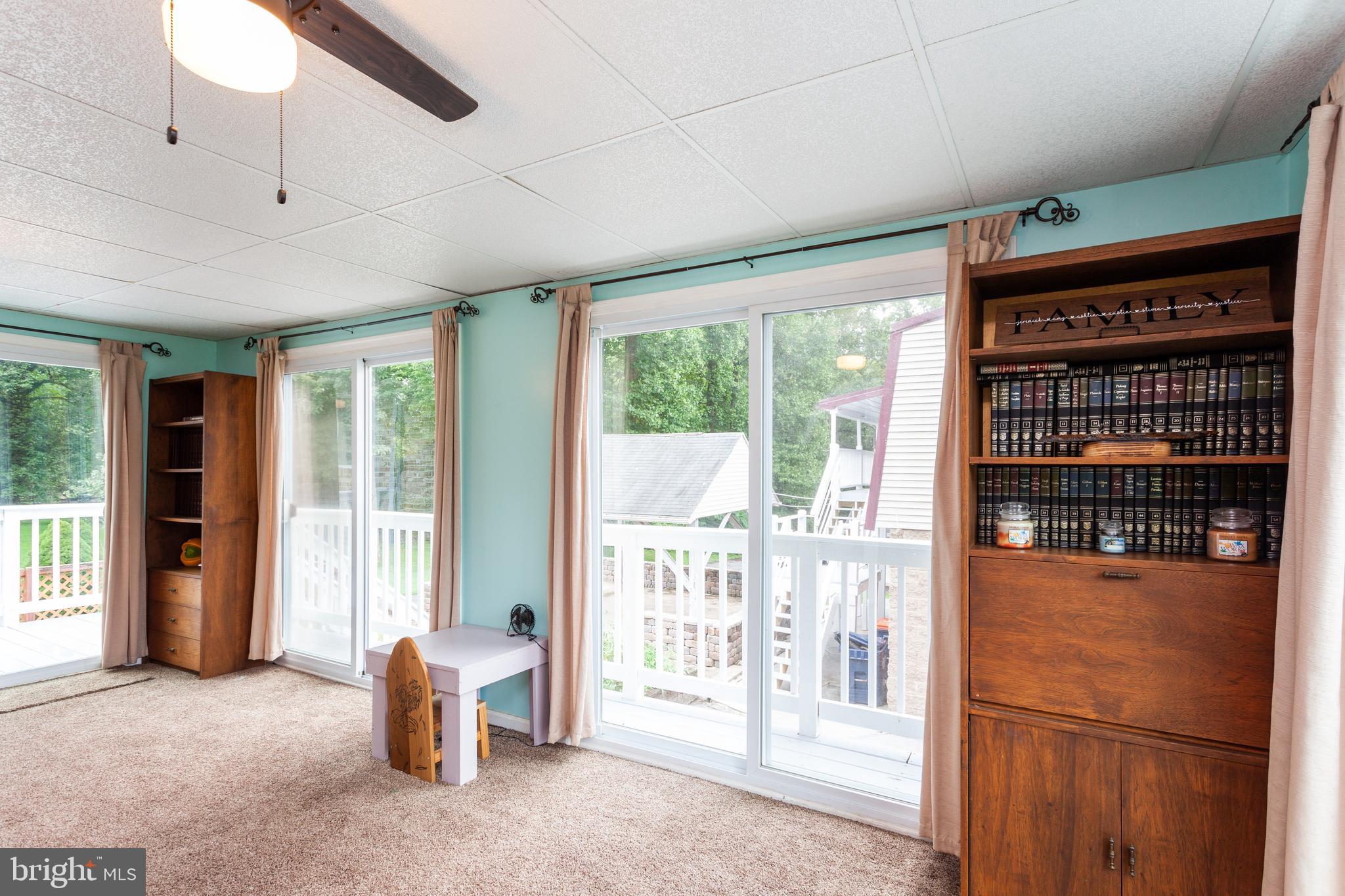 528 Conowingo Road Conowingo, MD 21918 - Photo 12 of 47 Rear sunroom with exposed brick